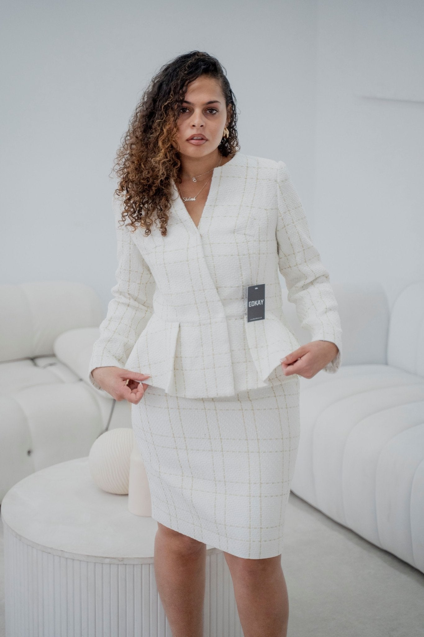 The pleated-peplum plaid tweed skirt suit (UK size 14)