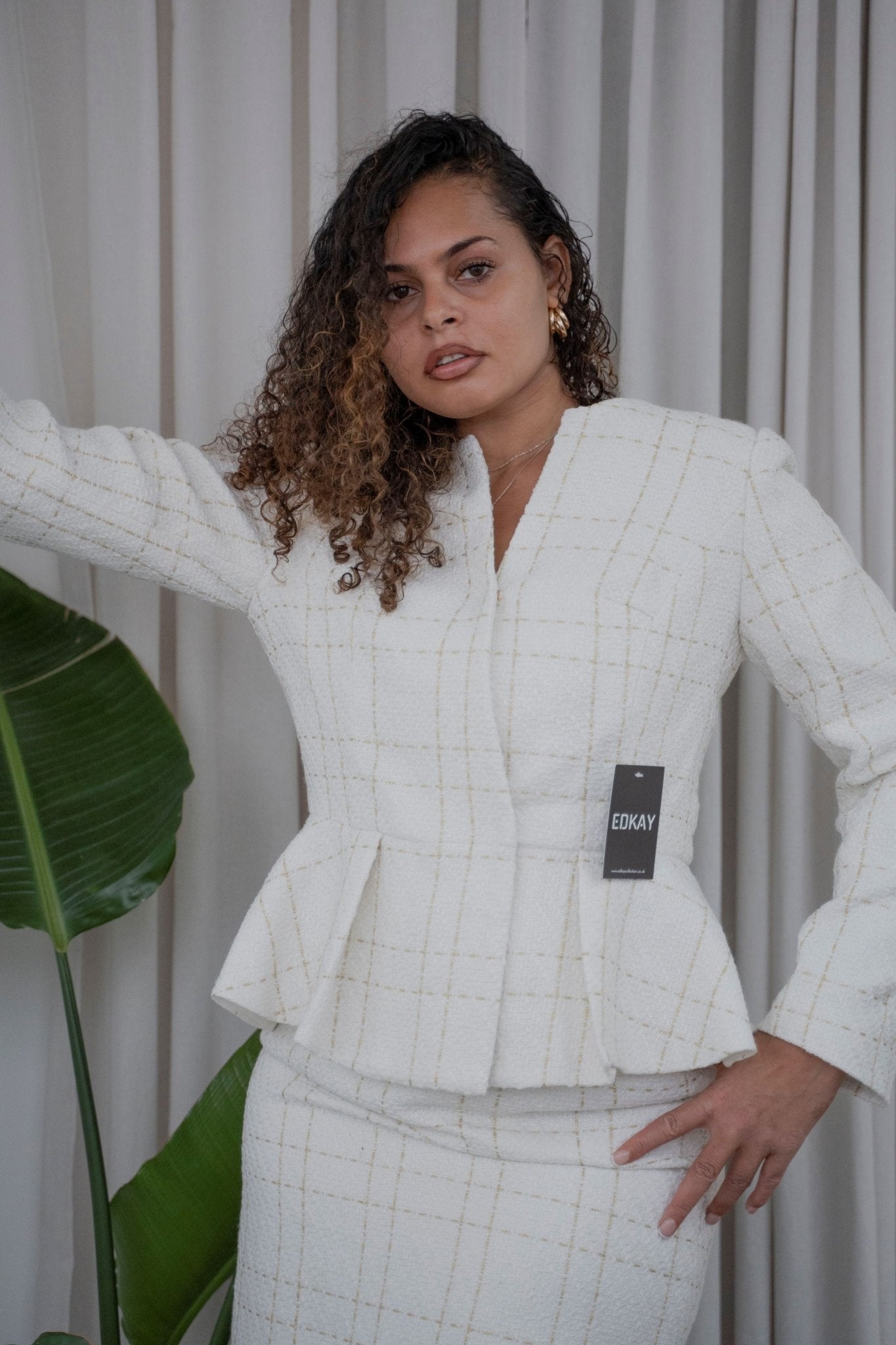 The pleated-peplum plaid tweed skirt suit (UK size 14)