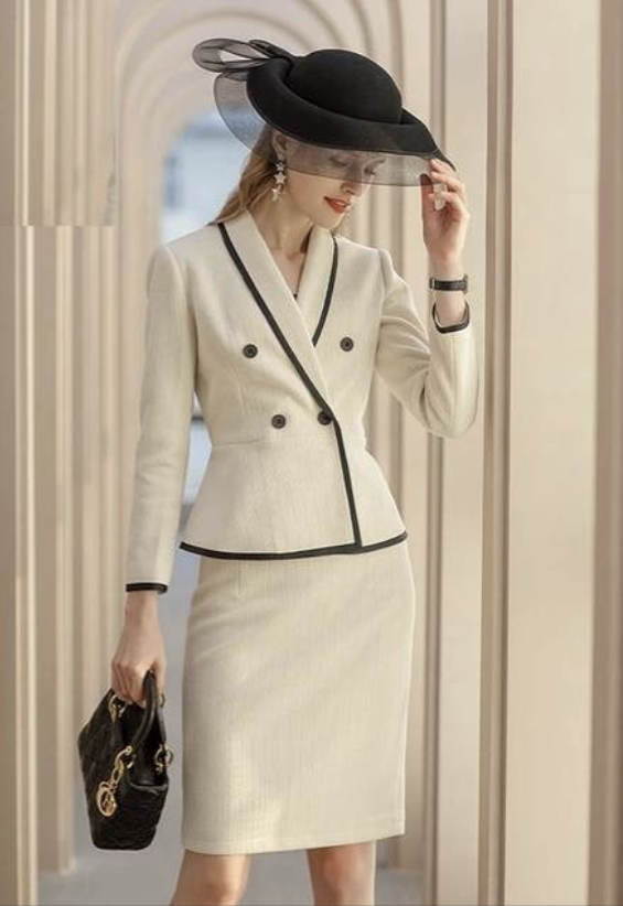 The beige piped peplum tweed skirt suit